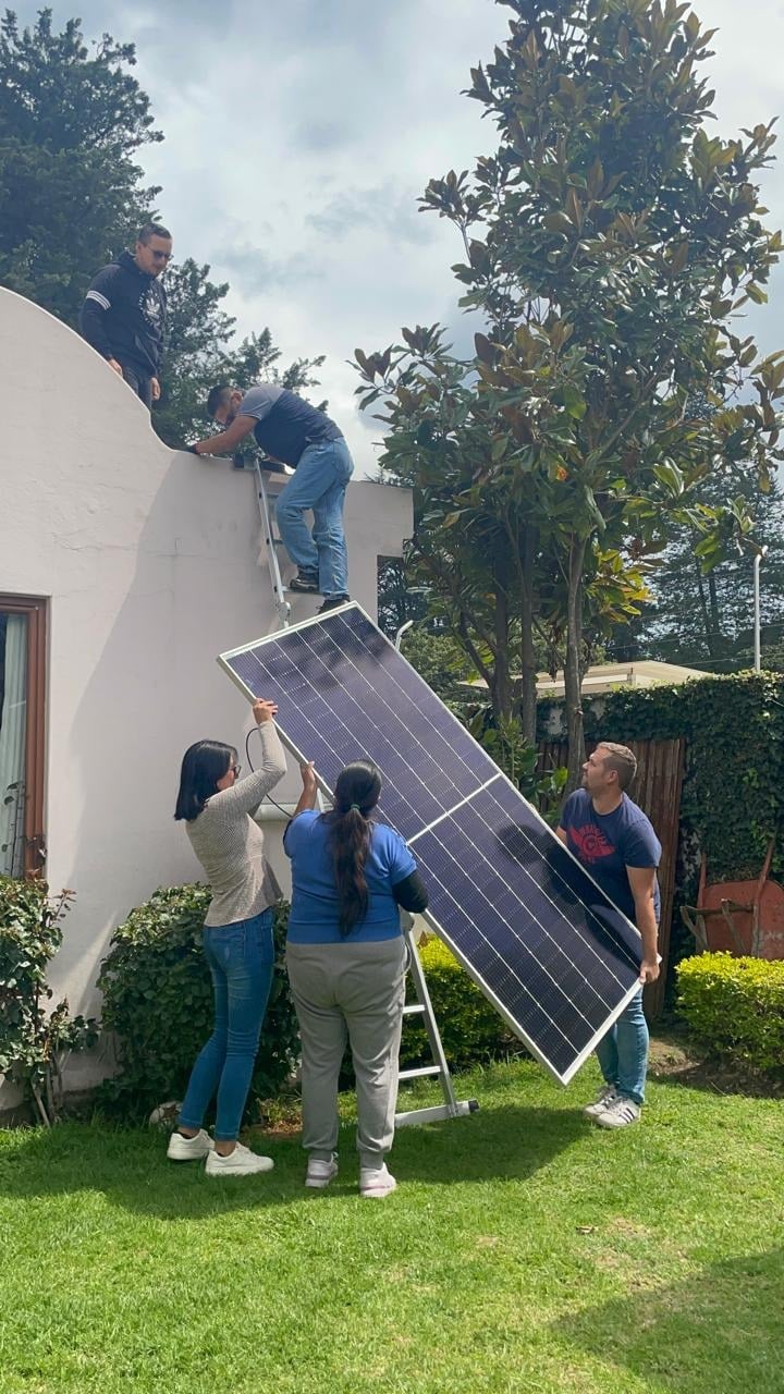 Workers installing solar panels